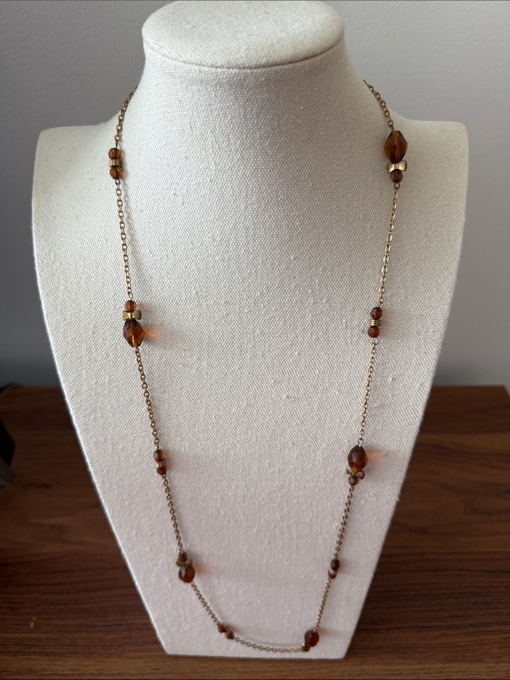 Vintage Long Station Gold Tone Necklace with Faceted Amber colored Beads.